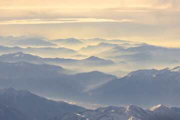 Fototapeta na wymiar Aerial view of morning sunlight on Summer Alps. 