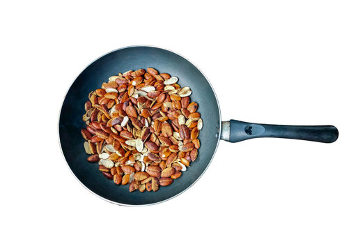 Irvingia malayana seeds on pan and white background