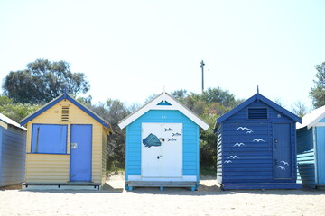 Fototapeta na wymiar Colorful cabins at the beach