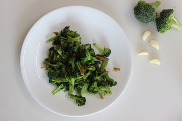 Stir fried broccoli with garlic and herbs