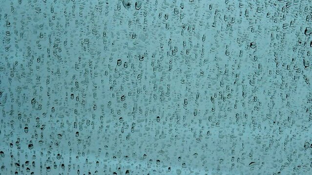 water drops fall in down with abstract background.
