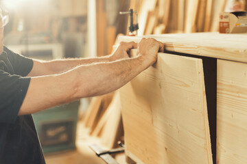 Carpenter's hands, strength, guiding lumber