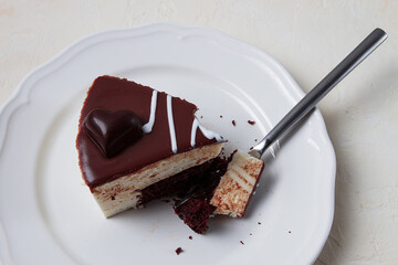 slice of cake, bird's milk, chocolate sponge cake with souffle, sweet dessert, on a white plate, close-up, horizontal, no people,
