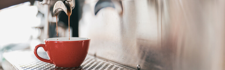 Close up view of preparing coffee espresso in automatic coffee machine in cafe
