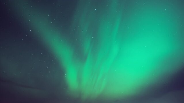 Aurora Borealis lighting up the night sky with green colors. Timelapse. 