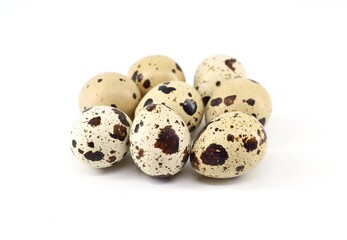 Obraz premium Group of quail eggs on white background.