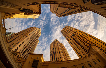 View up to sky with fisheye lens of the hotel towers at JBR Beach in Dubai UAE