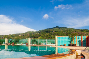 Fototapeta na wymiar Pool on the roof of the hotel on the terrace at patong beach in phuket island, thailand