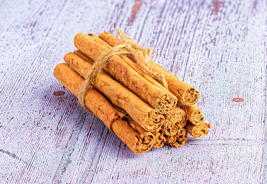 cinnamon sticks on wooden background
