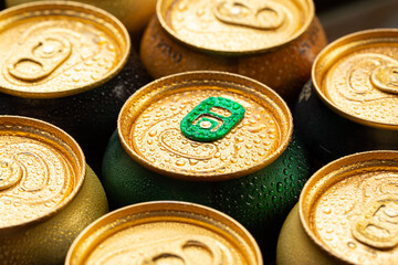 Many cans of beer top view, close-up.