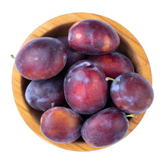Ripe plums in a bowl isolated on white background. Top view. File contains clipping path.