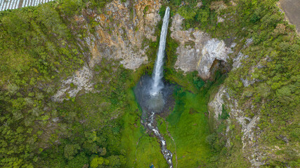 Waterfall in the tropical mountain. Sipiso Piso Falls in a mountain gorge. Sumatra, Indonesia.