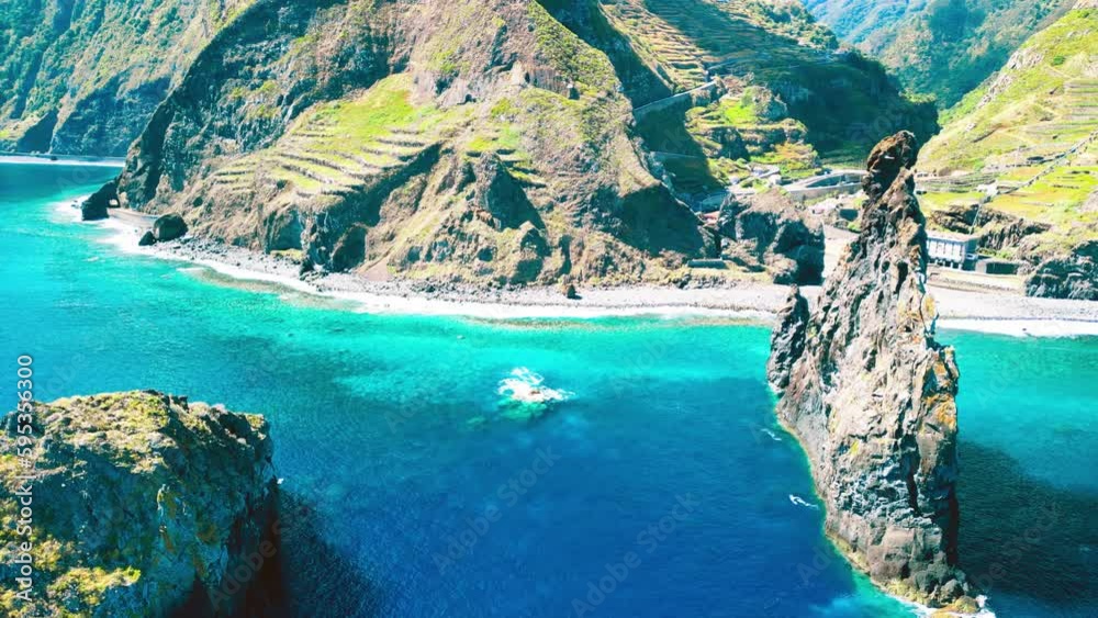 Poster Aerial view of tall lava rocks in ocean, islet towers in Ribeira da Janela, Madeira, Portugal