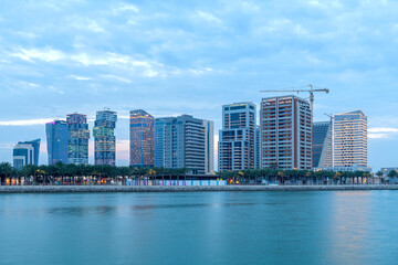 Fototapeta na wymiar Katara Twin Tower Hotel, Lusail Marina Park Doha, Qatar.