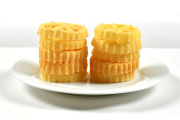 Sri Lankan Awrudu food, Kokiss. copy space. Sri lankan traditional festive food called Kokis on a white plate, white background. Kokis Plate.