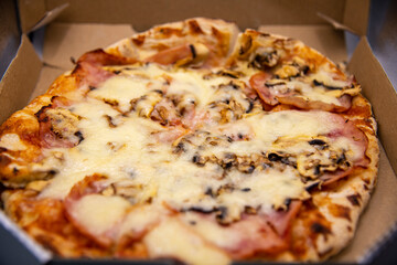 Delicious pizza (Pizza Capricciosa) in a box...
