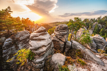 Cesky raj sandstone cliffs - Prachovske skaly in summer sunset, Czech Republic. Rock labyrinth is...