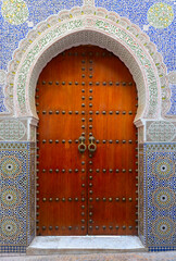 Fes, Morocco Stunning hand painted door of an old mosque with hand carved plaster work.