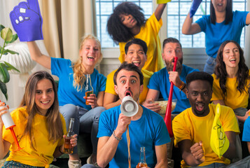 Soccer fan supporter friends cheering and watching football cup match at home Intenational - Group young people with multicolor t-shirts having fun with sport world championship concept