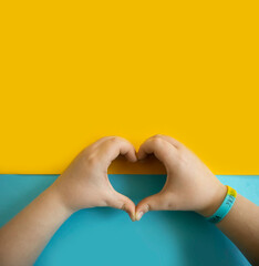 Fototapeta premium Children's hands on a colored background