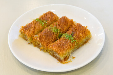 Turkish Dessert Sobiyet Baklava, mussels baklava and classic baklava with Pistachio . Didye, Cevizli, Fistikli Baklava, top view.