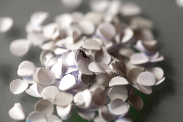 paper confetti out of the perforator