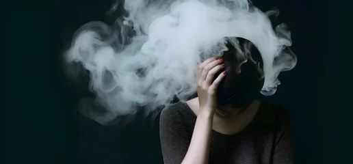 Foto auf Acrylglas Cloudy smoke covering the face of woman. Concept of depression, sadness or sorrow. © ZayNyi