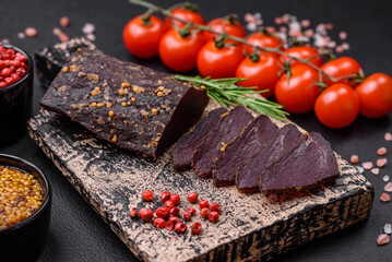 Delicious smoked Armenian basturma with spices and herbs