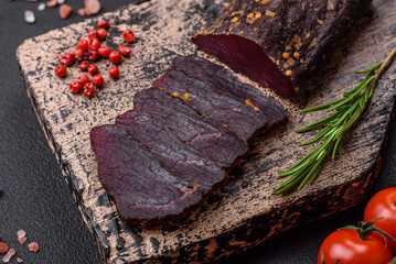 Delicious smoked Armenian basturma with spices and herbs