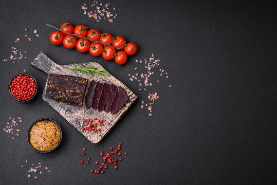 Delicious smoked Armenian basturma with spices and herbs