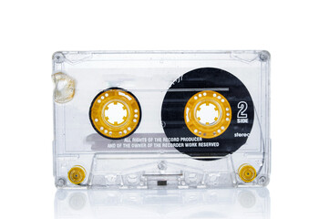 Old vintage audio cassette close up isolated on white background