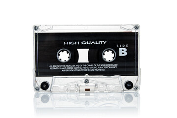 Old vintage audio cassette close up isolated on white background