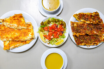 Table scene of assorted take out or delivery foods. Traditional Turkish cuisine. Various Turkish meal and appetizers. Top down view on a table.