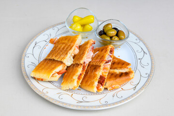 Turkish karisik atom Ayvalik tost ( kasarli bazlama tost) . Sucuklu, Kasarli, kavurmali karisik tost. Flat baked bread toasted