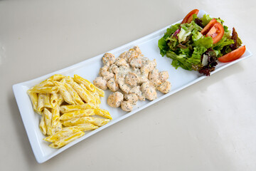 Macaroni Salad with red bell pepper, onion, celery, gherkins and mayonnaise dressing.Traditional...