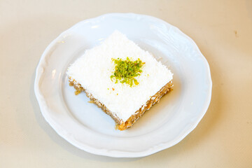 San sebastian ( Bask ) cheesecake slice isolated close up. Limon, lotus, fistikli, Frambuazli...