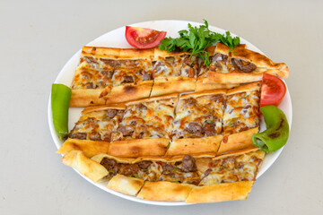 Kiymali pide. Turkish pide with minced meat. Turkish pizza mince pita Pide on white background. Etli ekmek. Kusbasi kasarli pide.