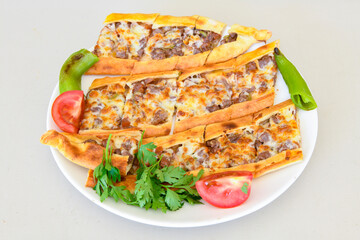 Kiymali pide. Turkish pide with minced meat. Turkish pizza mince pita Pide on white background. Etli ekmek. Kusbasi kasarli pide.