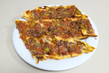 Kiymali pide. Turkish pide with minced meat. Turkish pizza mince pita Pide on white background. Etli ekmek. Kusbasili pide.
