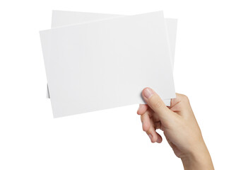 Hand holding two small sheets of paper (tickets, flyers, invitations, coupons, photocards, etc.), cut out