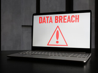 Data breach is shown using the text on the screen of laptop