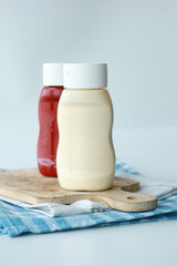 close up of Mayonnaise in container on table .