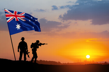 Fototapeta na wymiar Silhouettes of soldiers with Australia flag on background of the sunset or the sunrise background. Anzac Day. Remembrance Day.
