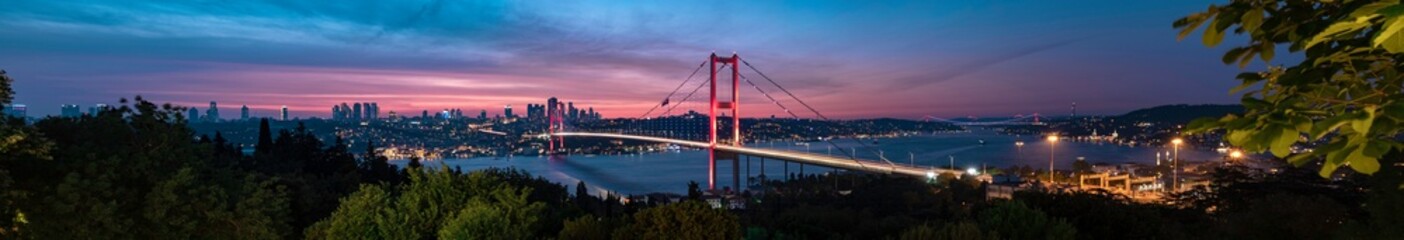 Fototapeta na wymiar Istanbul Bosphorus panoramic photo. Istanbul landscape beautiful sunset with clouds Ortakoy Mosque, Bosphorus Bridge, Fatih Sultan Mehmet Bridge Istanbul Turkey.Best touristic destination of Istanbul