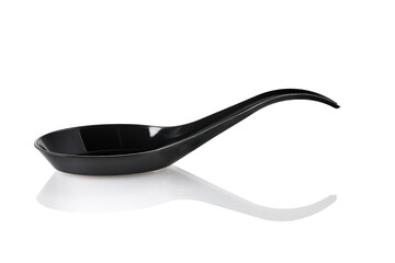 Plastic black disposable spoon isolated on a white background. Full depth of field. Close-up