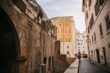 Fototapeta na wymiar Walking through the city streets of ancient Rome in Italy