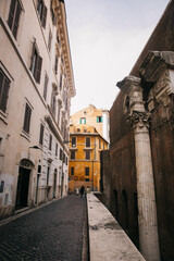 Walking through the city streets of ancient Rome in Italy