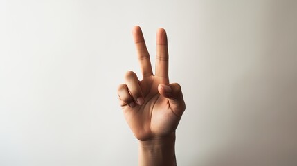 Hand raising index and middle fingers, displaying the peace sign, generative ai