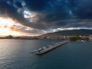 Fototapeta premium Aerial iconic sunset view over the port of Kalamata seaside city in Messenia, Greece