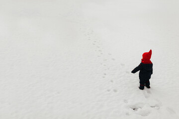 child playing in snow